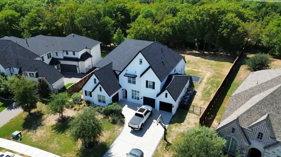The finished roof in charcoal shingles, seen from above