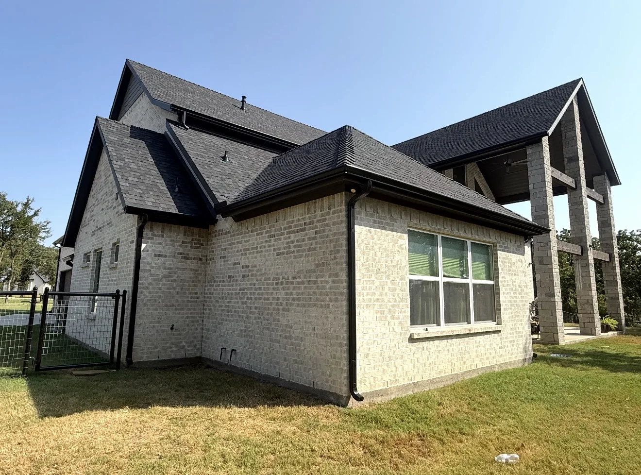Roof replacement: White brick, dark shingle